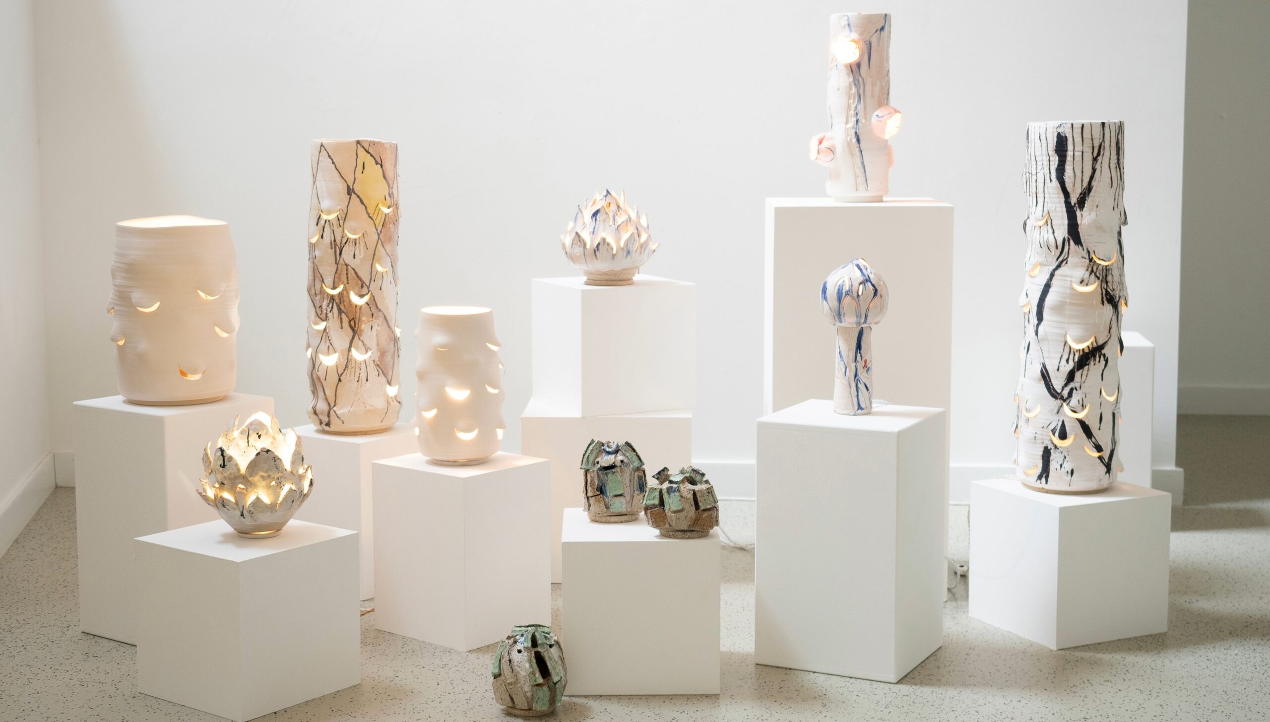 Overview of the Emergence exhibition featuring ceramic light sculptures by Nathalie Hunter.